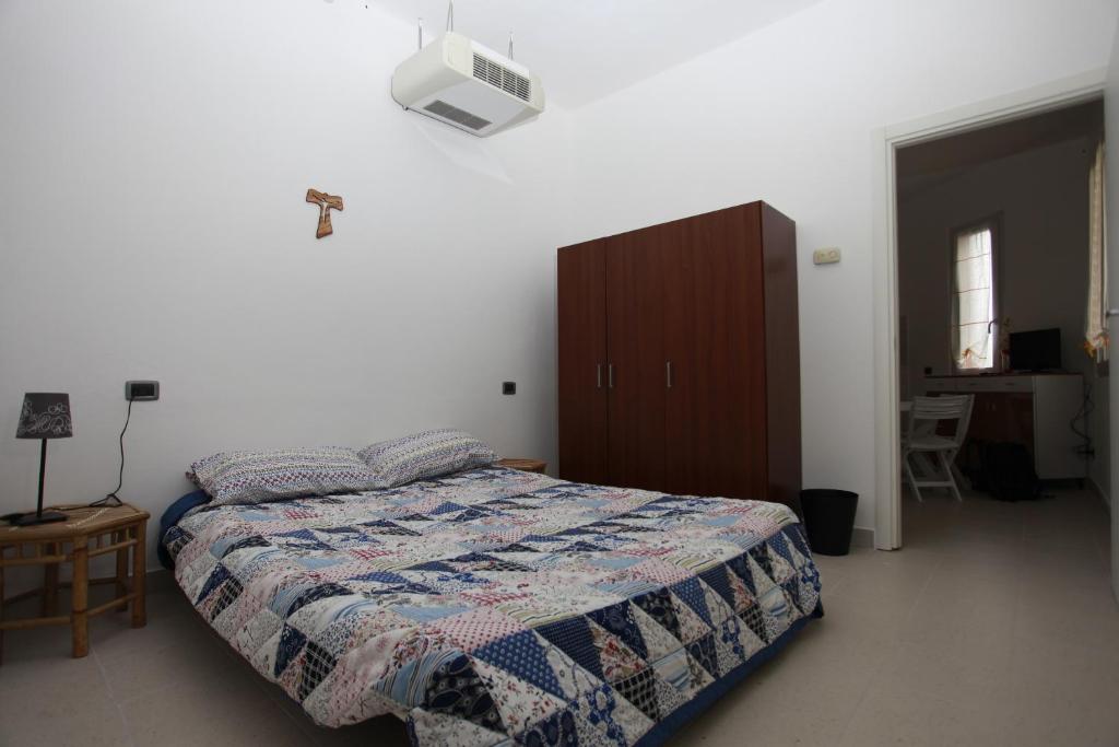 Łóżko lub łóżka w pokoju w obiekcie Apartment Lake Maggiore - ITALIA