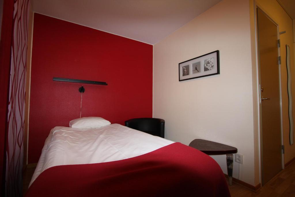 Postel nebo postele na pokoji v ubytování Hotell Linnéa