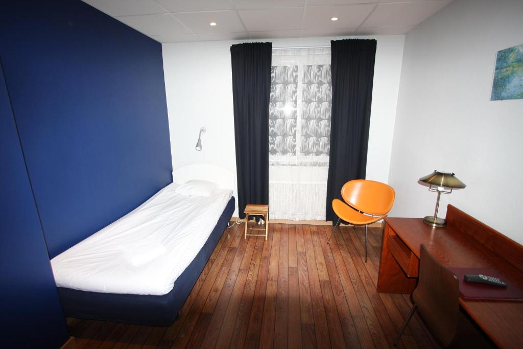 Postel nebo postele na pokoji v ubytování Hotell Linnéa