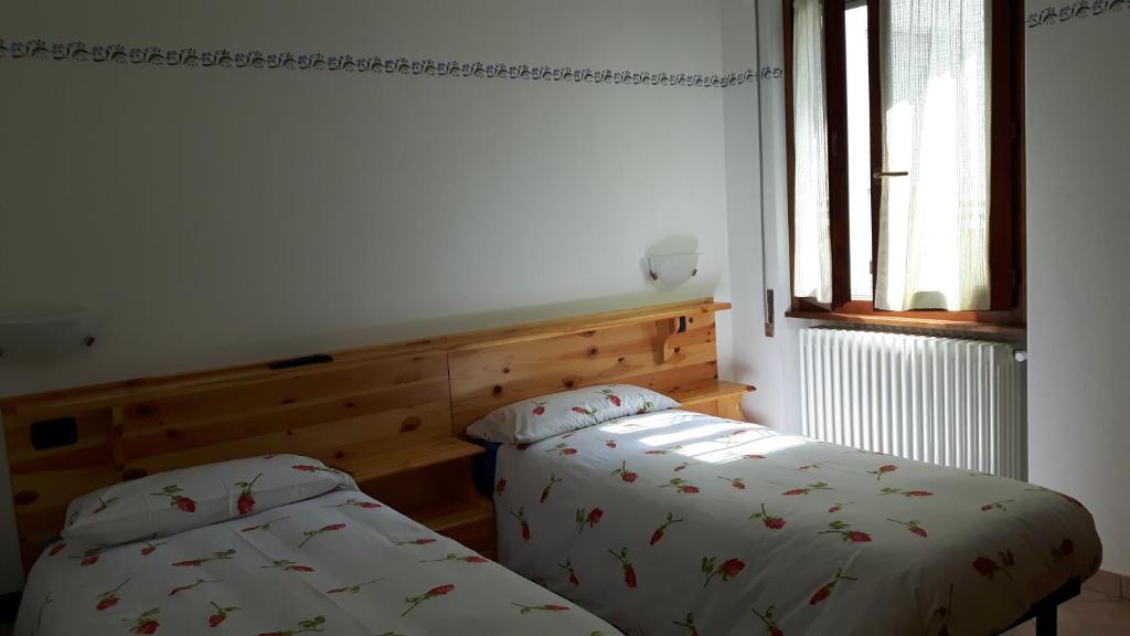 Postel nebo postele na pokoji v ubytování Trattoria Bar Pace