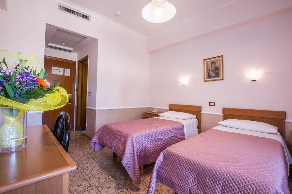 Postel nebo postele na pokoji v ubytování Hotel Casa Tra Noi