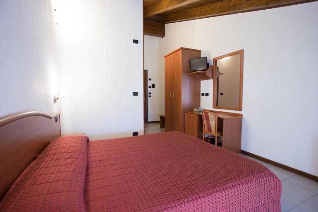 Postel nebo postele na pokoji v ubytování Vald Hotel