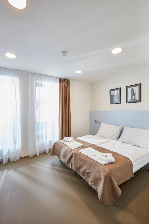Postel nebo postele na pokoji v ubytování Hotel Ryzlink