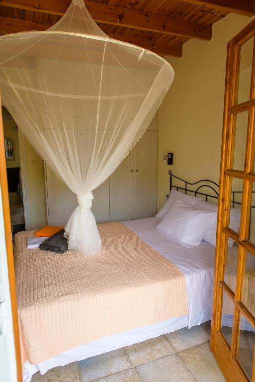 Postel nebo postele na pokoji v ubytování Marianna Cottage