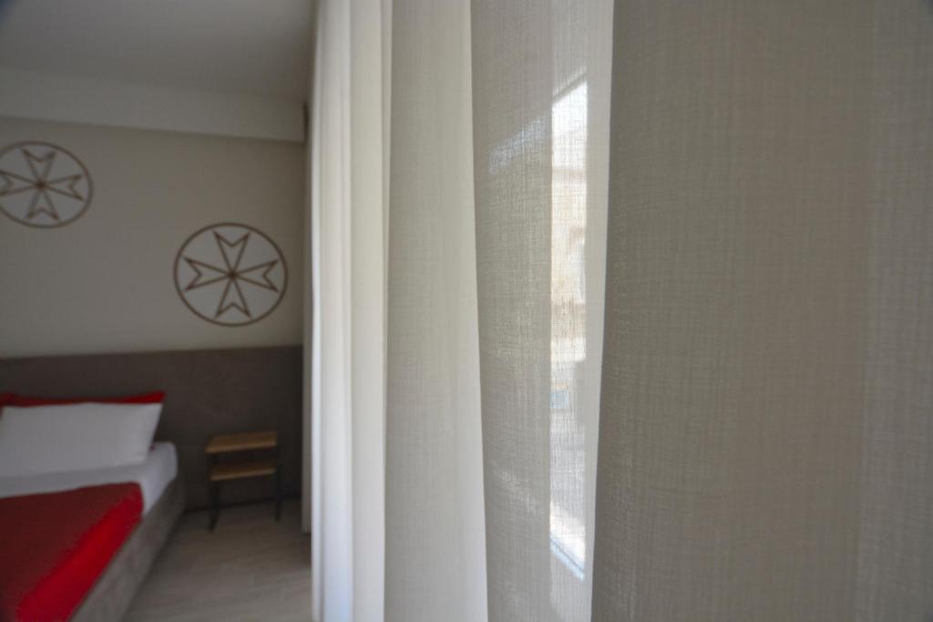 A bed or beds in a room at Il Rifugio Dei Templari