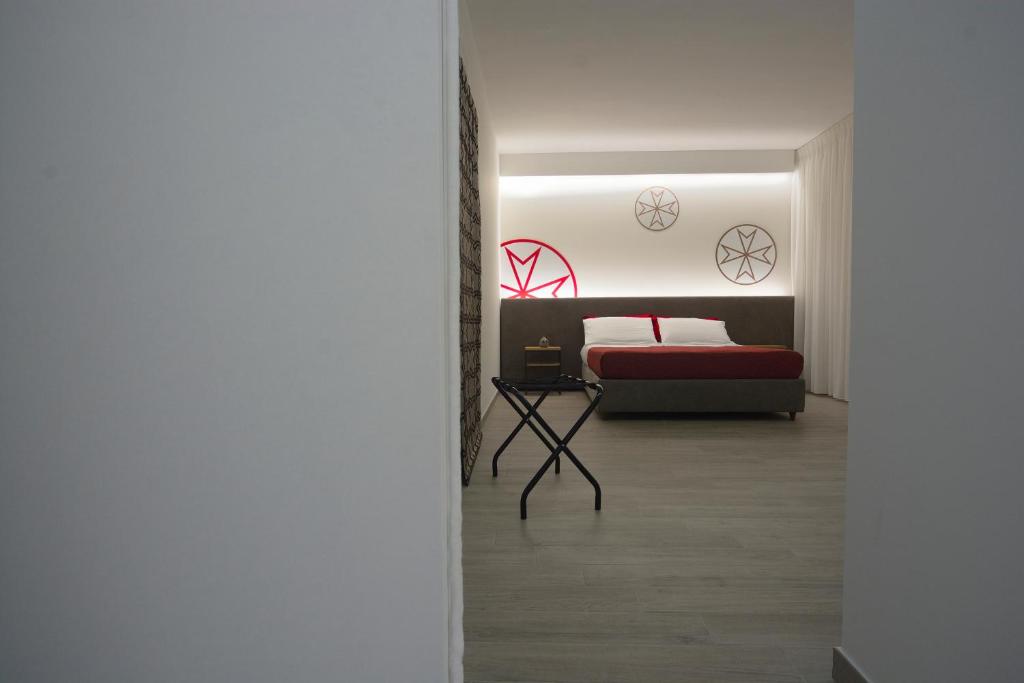 A bed or beds in a room at Il Rifugio Dei Templari