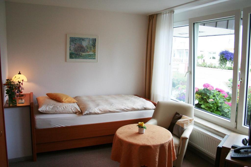 Postel nebo postele na pokoji v ubytování Hotel Villa Undine