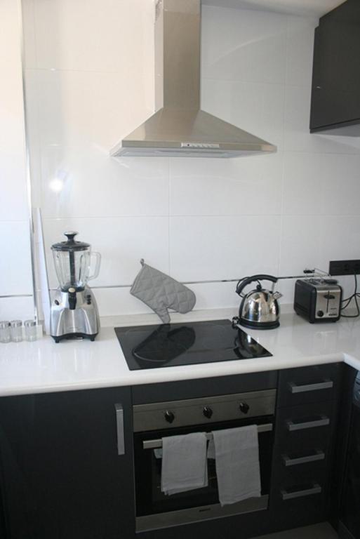 Kuchyň nebo kuchyňský kout v ubytování OasisBeach Penthousse la Zénia