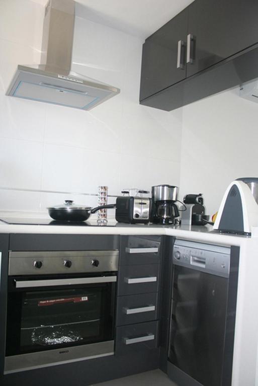 Kuchyň nebo kuchyňský kout v ubytování OasisBeach Penthousse la Zénia