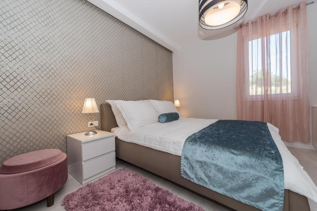Postel nebo postele na pokoji v ubytování Villa Franica