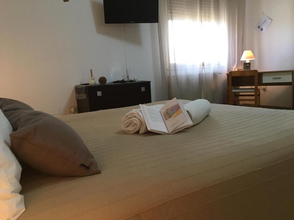 Posteľ alebo postele v izbe v ubytovaní A casa di Nonna Maria