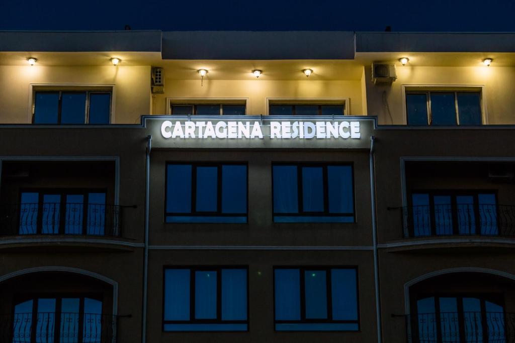 a building with a sign that reads carrarica residence at Cartagena Apartments in Mamaia Nord
