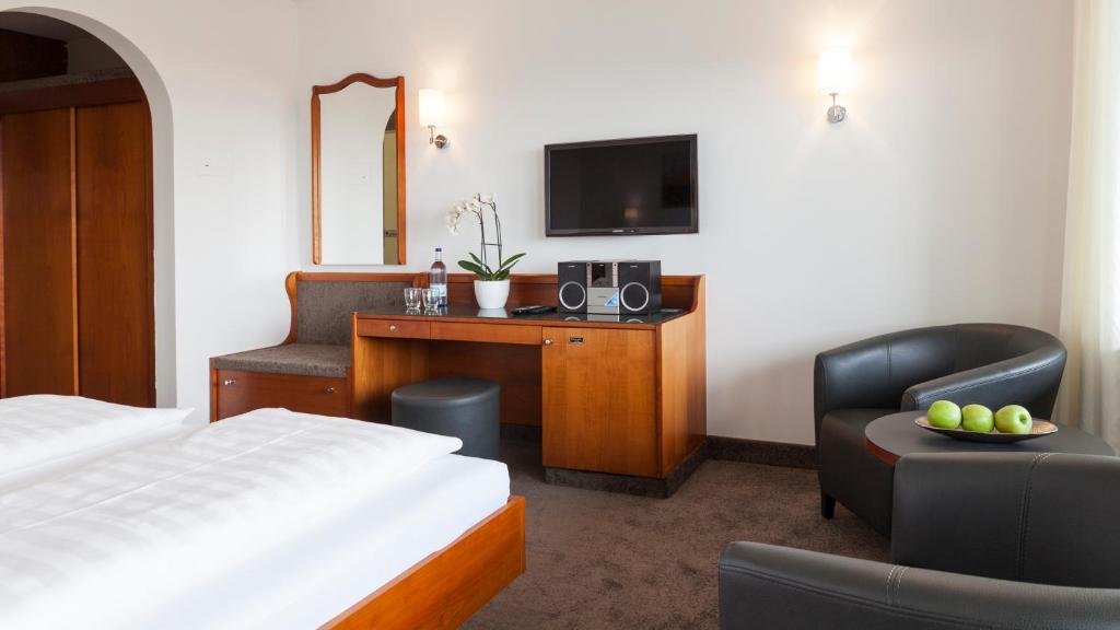 Postel nebo postele na pokoji v ubytování Hotel Restaurant Hansjakob