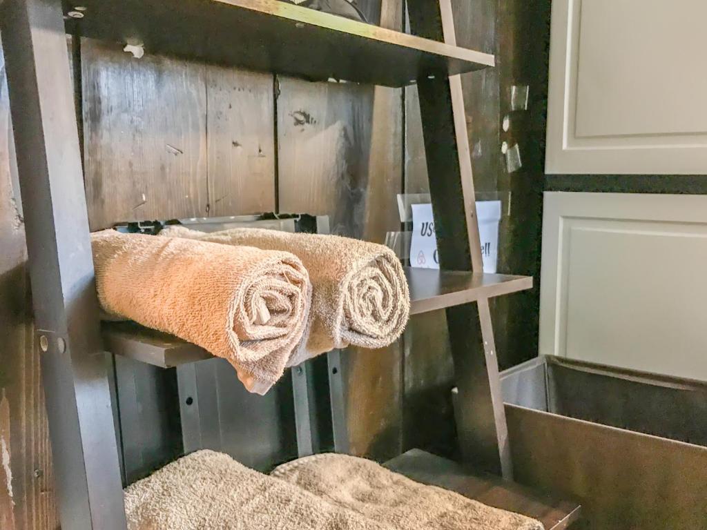 two towels on a shelf in a bathroom at Co-ed Dorm with Fantastic Patio! in Ewing