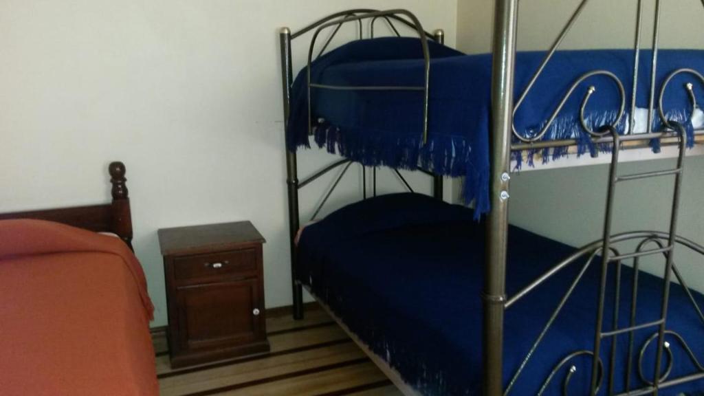 Postel nebo postele na pokoji v ubytování Hostal Puertas Del Sol