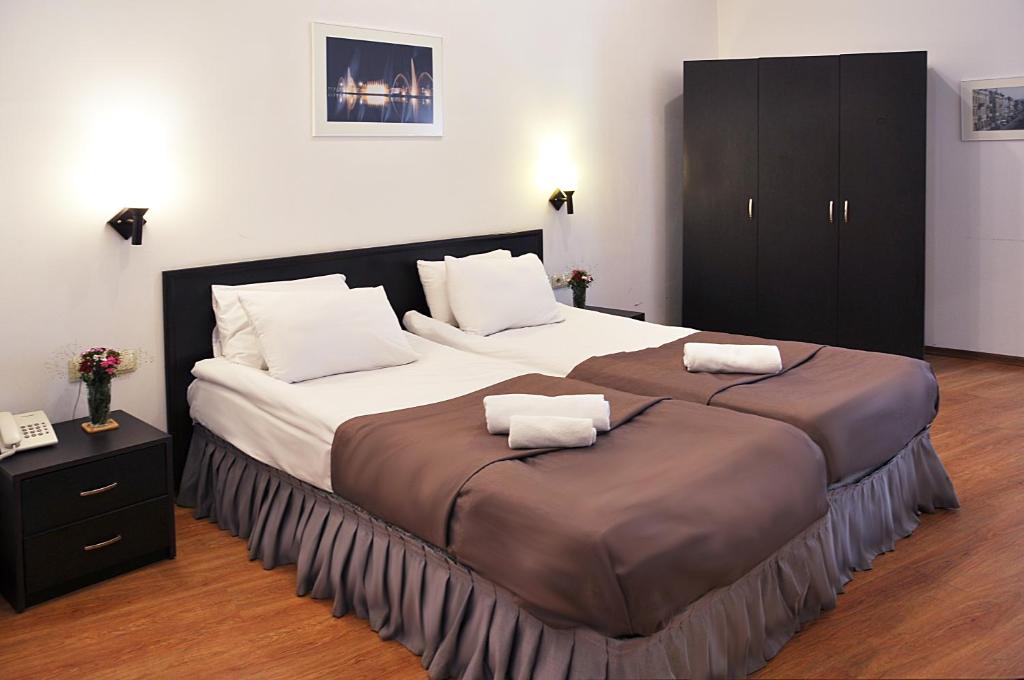 Postel nebo postele na pokoji v ubytování Hotel Corner