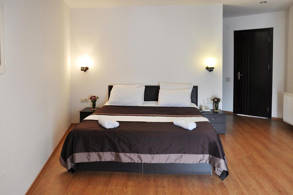 Postel nebo postele na pokoji v ubytování Hotel Corner