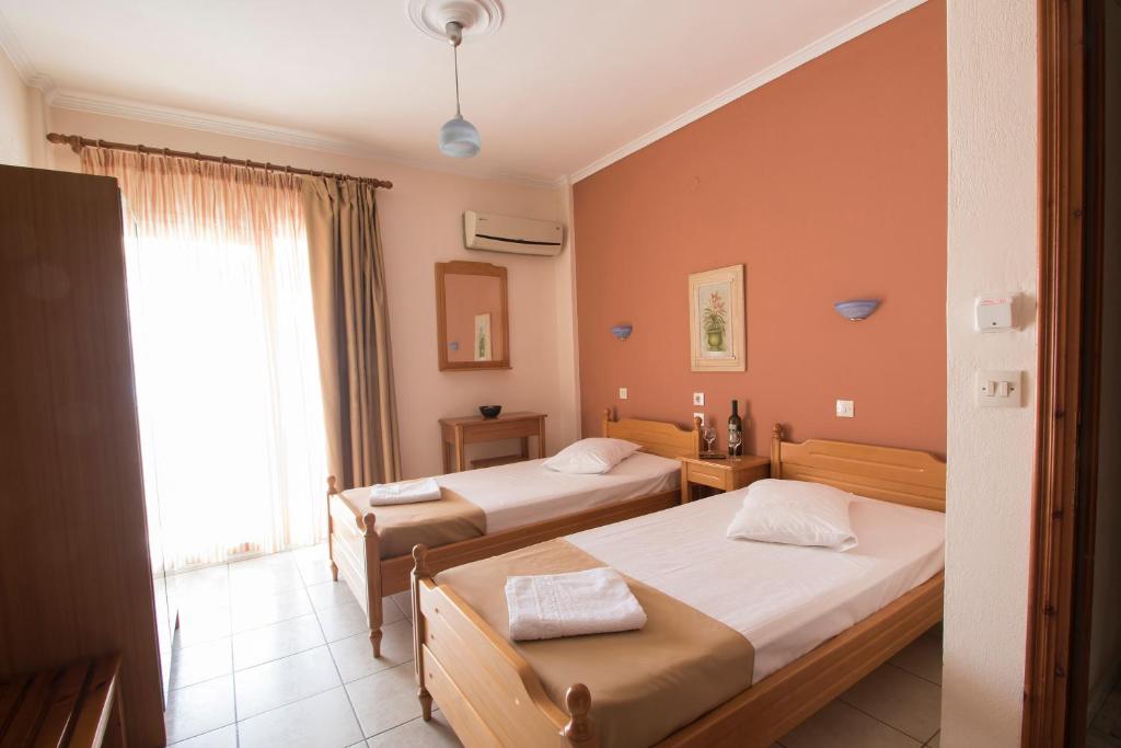 Postel nebo postele na pokoji v ubytování Atira Apartment Hotel