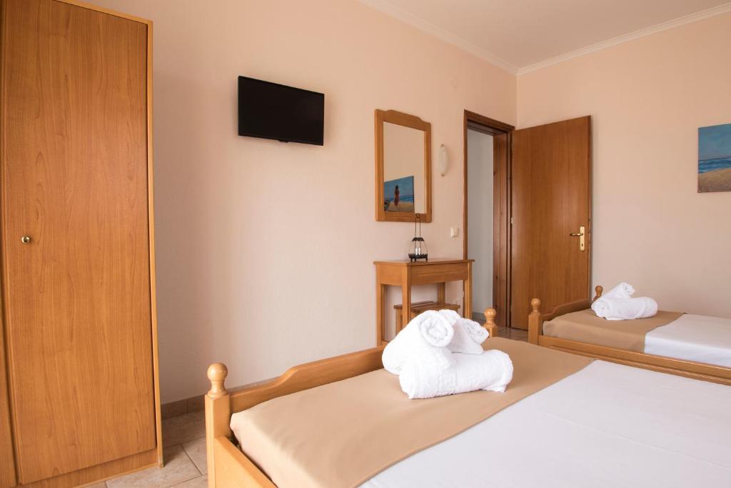 Postel nebo postele na pokoji v ubytování Atira Apartment Hotel