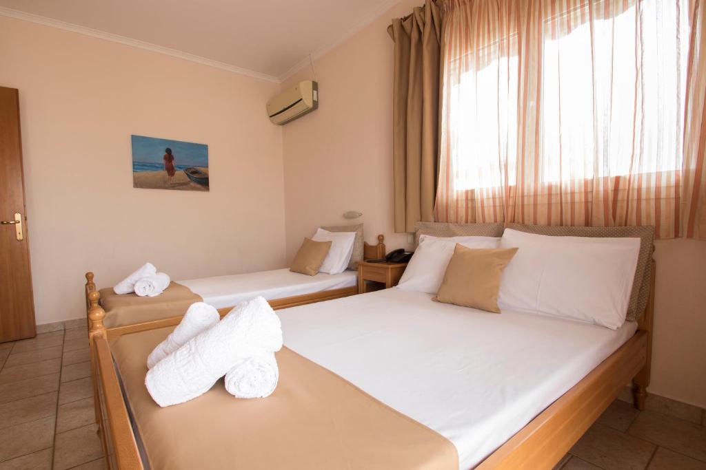 Postel nebo postele na pokoji v ubytování Atira Apartment Hotel