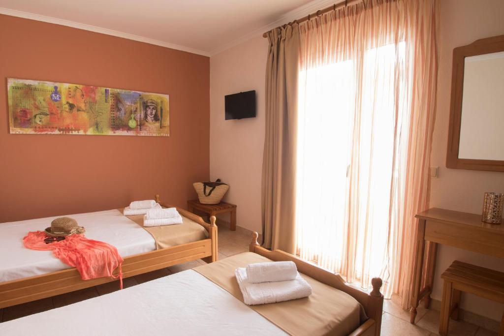 Postel nebo postele na pokoji v ubytování Atira Apartment Hotel
