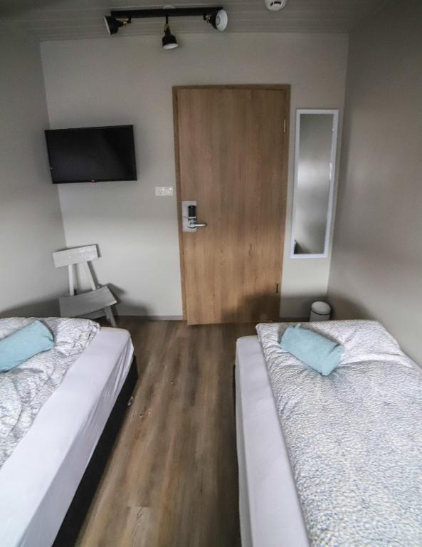 Postel nebo postele na pokoji v ubytování Lava Guesthouse