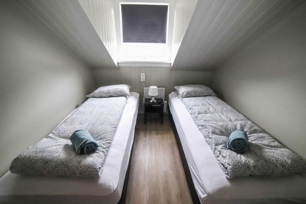 Postel nebo postele na pokoji v ubytování Lava Guesthouse