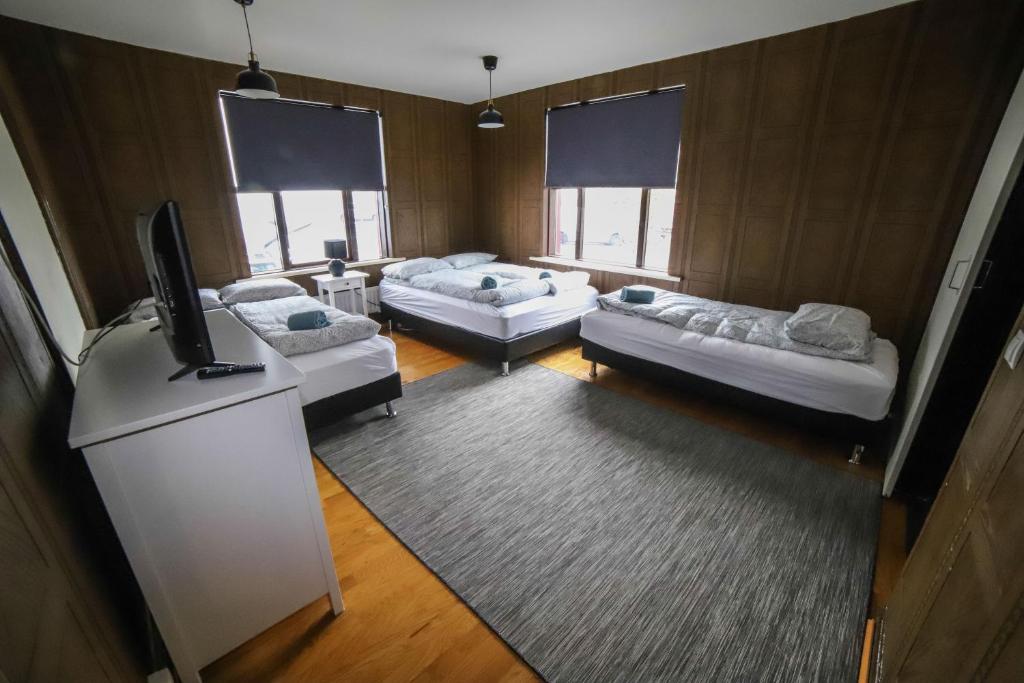 Postel nebo postele na pokoji v ubytování Lava Guesthouse