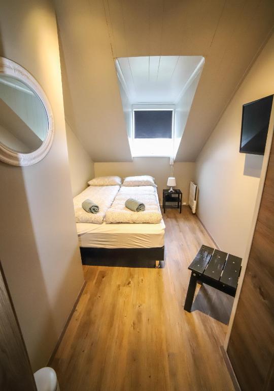 Postel nebo postele na pokoji v ubytování Lava Guesthouse