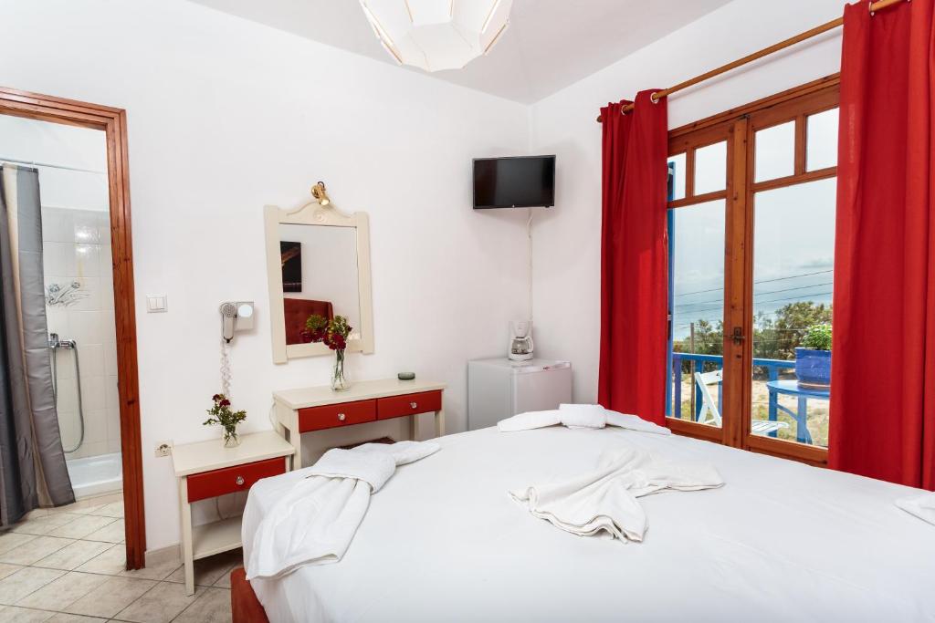 Postel nebo postele na pokoji v ubytování Ragoussis House