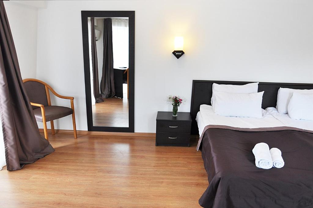 Postel nebo postele na pokoji v ubytování Hotel Corner