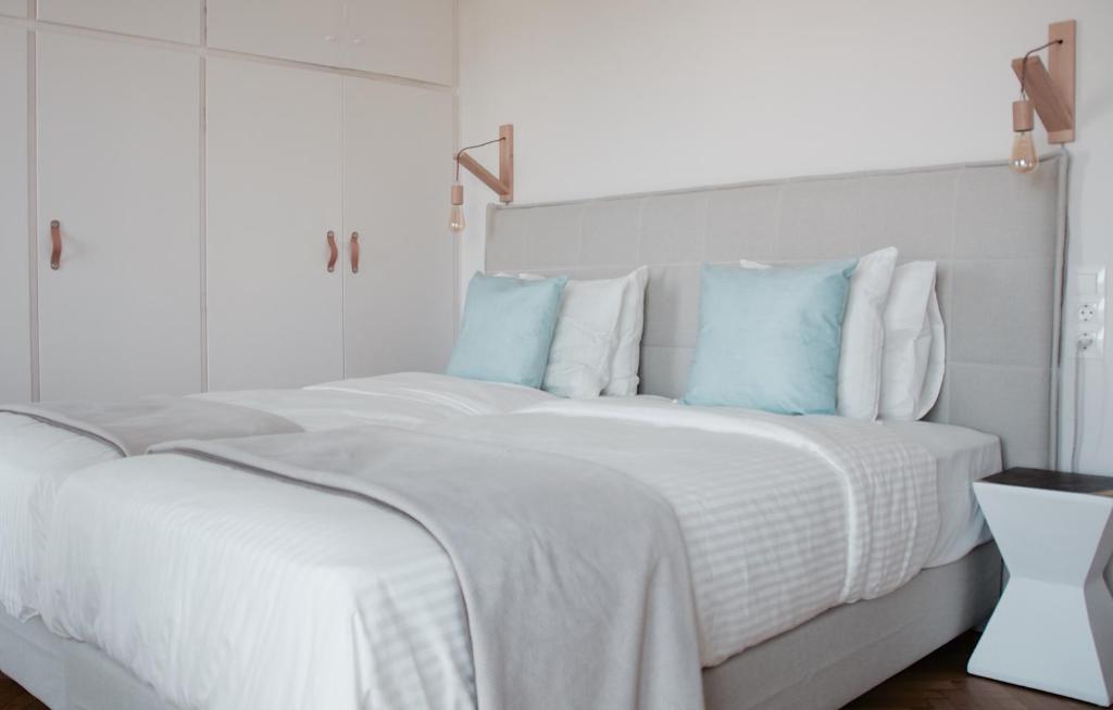 Posteľ alebo postele v izbe v ubytovaní Athens Grand Suite