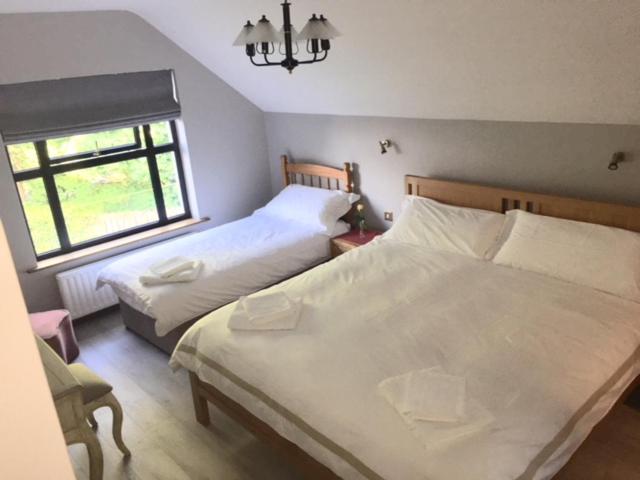 Postel nebo postele na pokoji v ubytování Ivy House