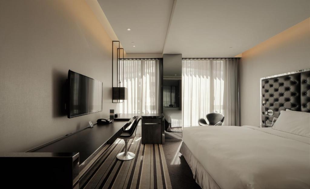 TV a/nebo společenská místnost v ubytování Starhaus Hotel