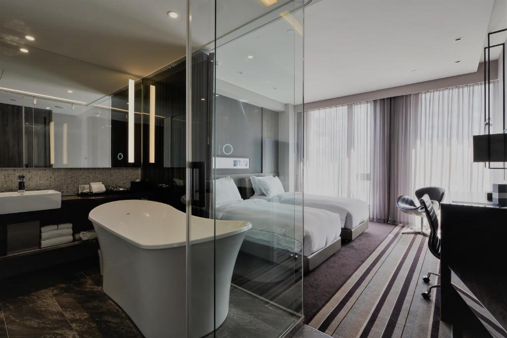 Postel nebo postele na pokoji v ubytování Starhaus Hotel