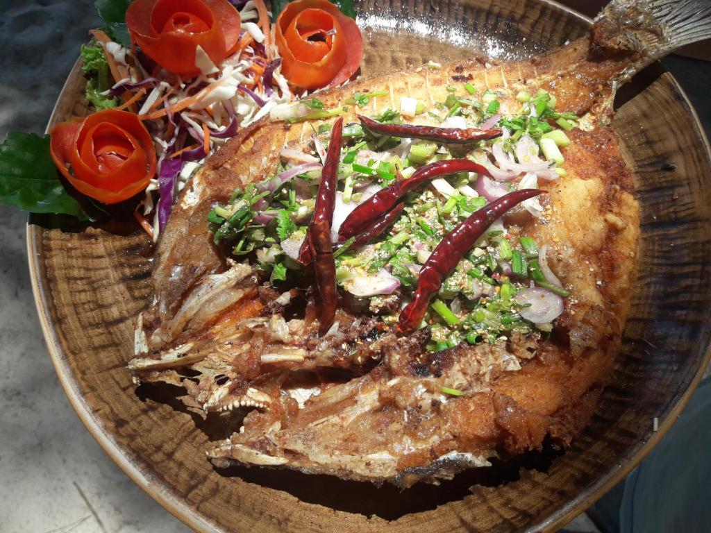 a plate of food with a salad on it at JJ Beach Resort & JJ Seafood in Ko Phayam