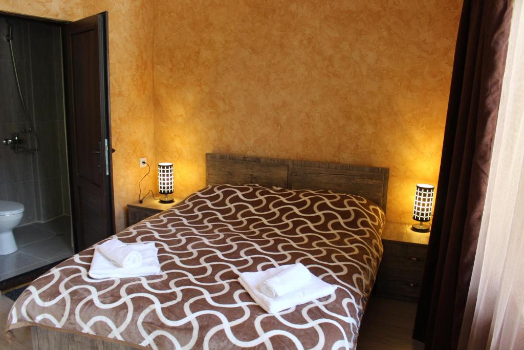 Postel nebo postele na pokoji v ubytování Maia's Guesthouse