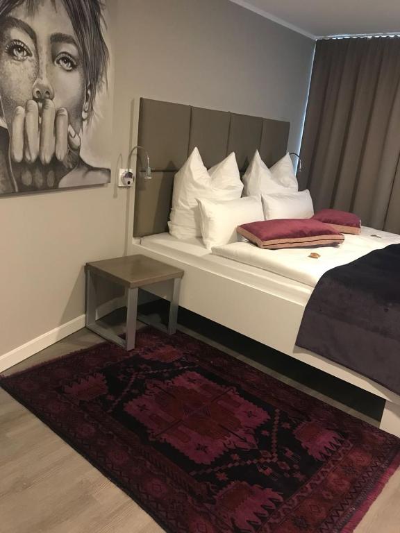 Postel nebo postele na pokoji v ubytování Trip Inn PostApart Aschaffenburg