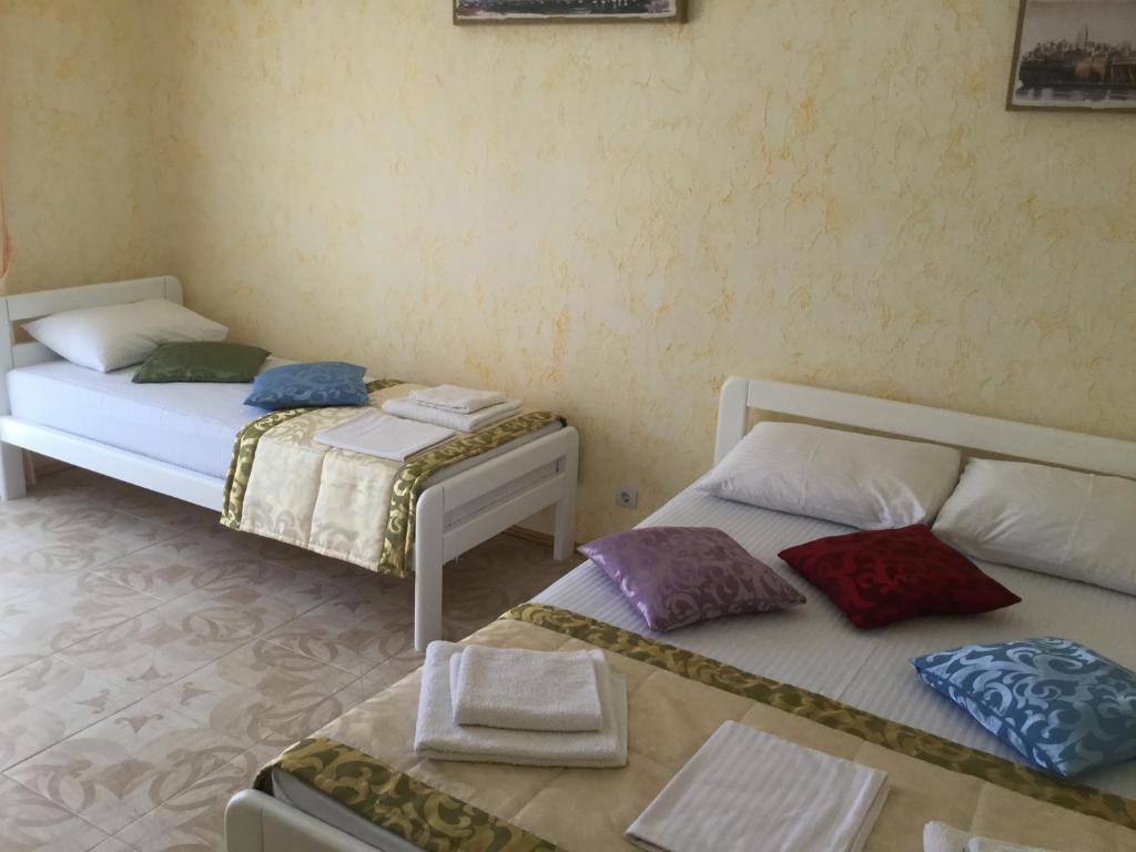 Postel nebo postele na pokoji v ubytování Aura