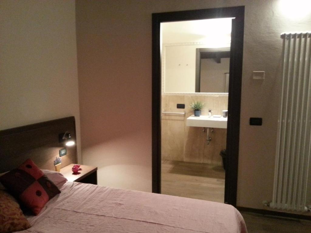 Łóżko lub łóżka w pokoju w obiekcie Hotel La Vecchia Reggio