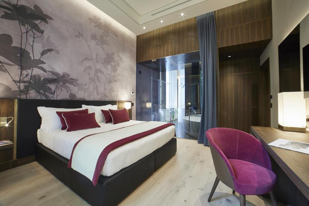 Posteľ alebo postele v izbe v ubytovaní Messori Suites