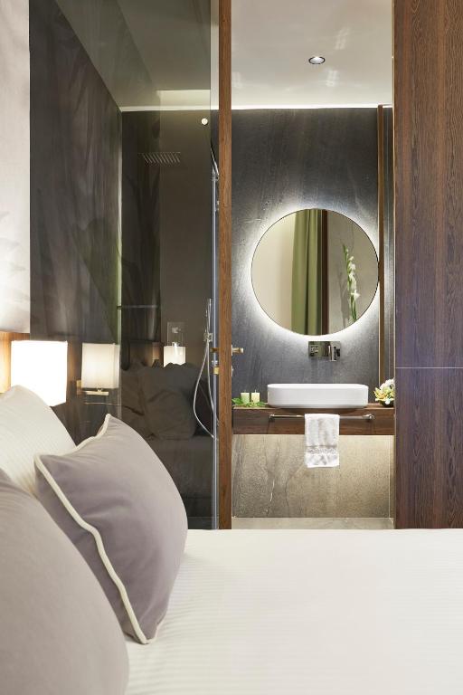 Posteľ alebo postele v izbe v ubytovaní Messori Suites