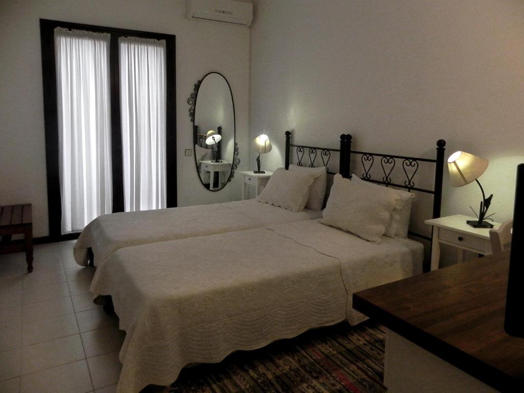Postel nebo postele na pokoji v ubytování Ulysses Hotel