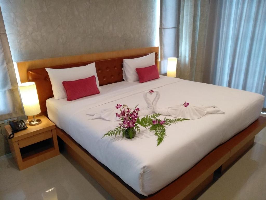 Postel nebo postele na pokoji v ubytování De Loft Hotel