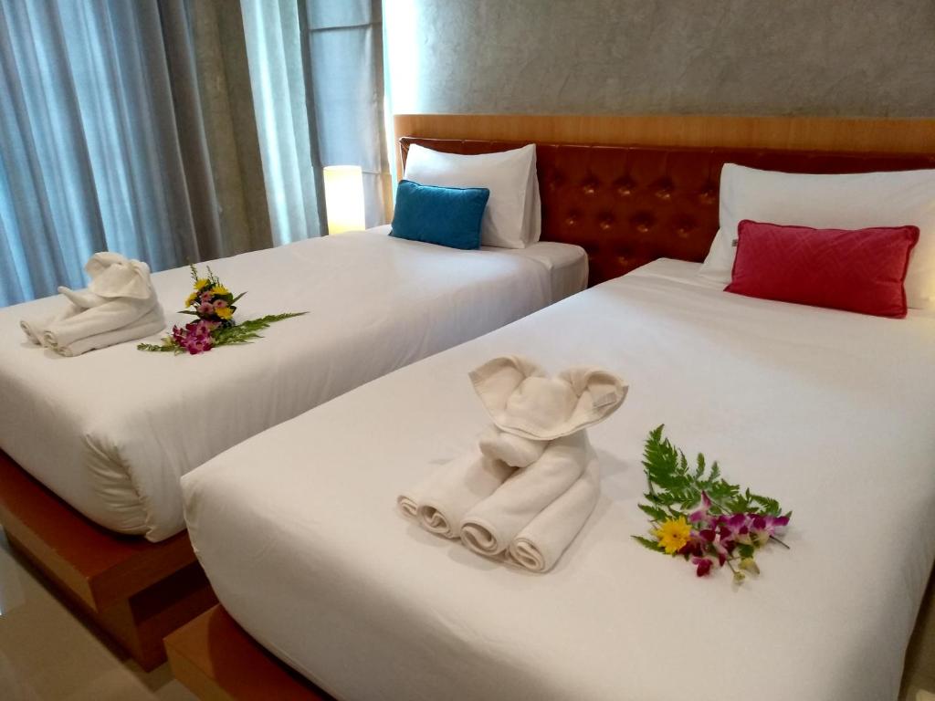 Postel nebo postele na pokoji v ubytování De Loft Hotel