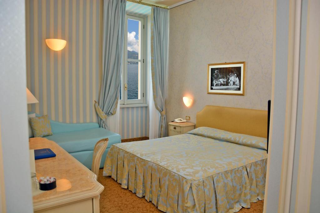 Postel nebo postele na pokoji v ubytování Grand Hotel Menaggio