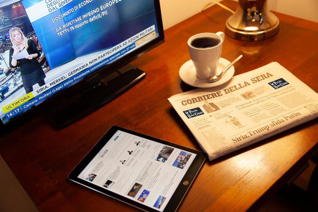 TV a/nebo společenská místnost v ubytování Hotel Ristorante Piccolo Chianti