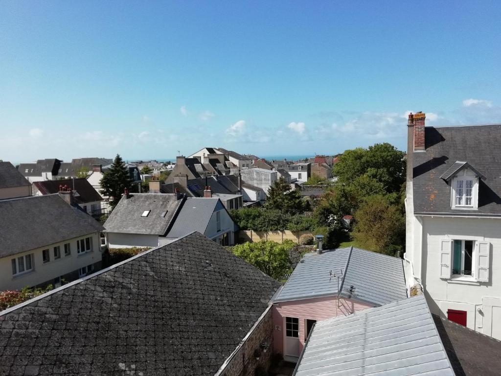 a view of a town with roofs at L'escale Granvillaise in Granville
