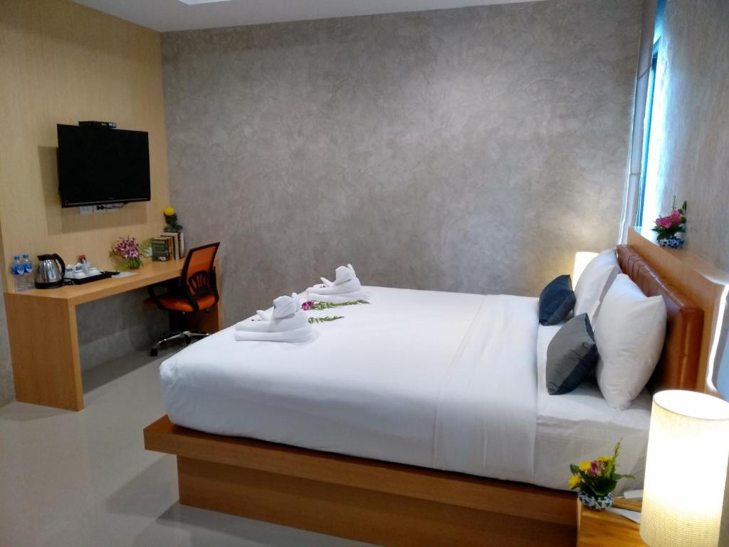 Postel nebo postele na pokoji v ubytování De Loft Hotel