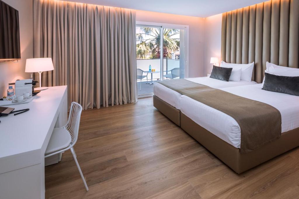 Postel nebo postele na pokoji v ubytování Hotel Playafels